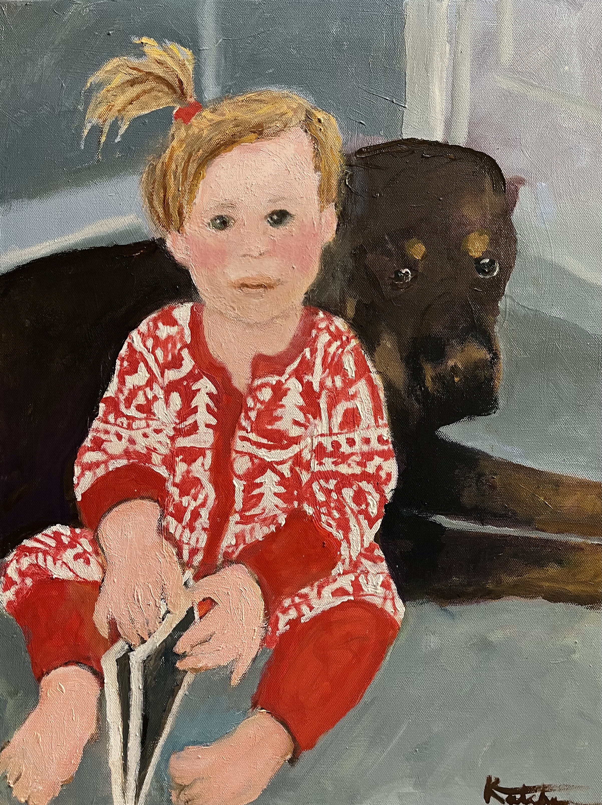 Child in holiday sweater with dog